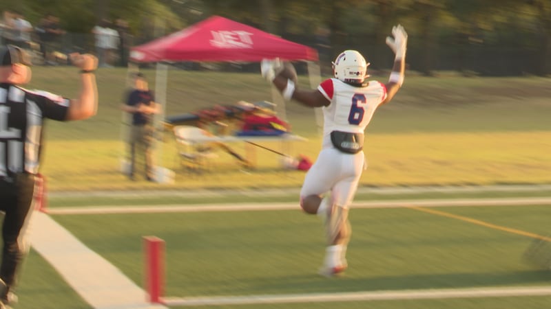 Midway's Chauncey King gets a scoop and score after a blocked field goal