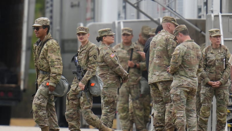 Military personnel in uniform, with the Texas National Guard patch on, are seen at the U.S....
