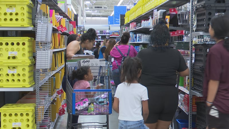 Parents and kids shopping at a Walmart in Temple for the 11th Annual Back to School Extravaganza
